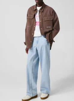 Light blue wide-leg jeans with curved logo