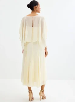 Long vanilla white flowy dress with cape