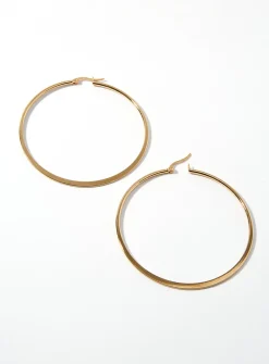 Oversized golden hoops