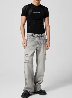 Raw edging mended flared-leg jean