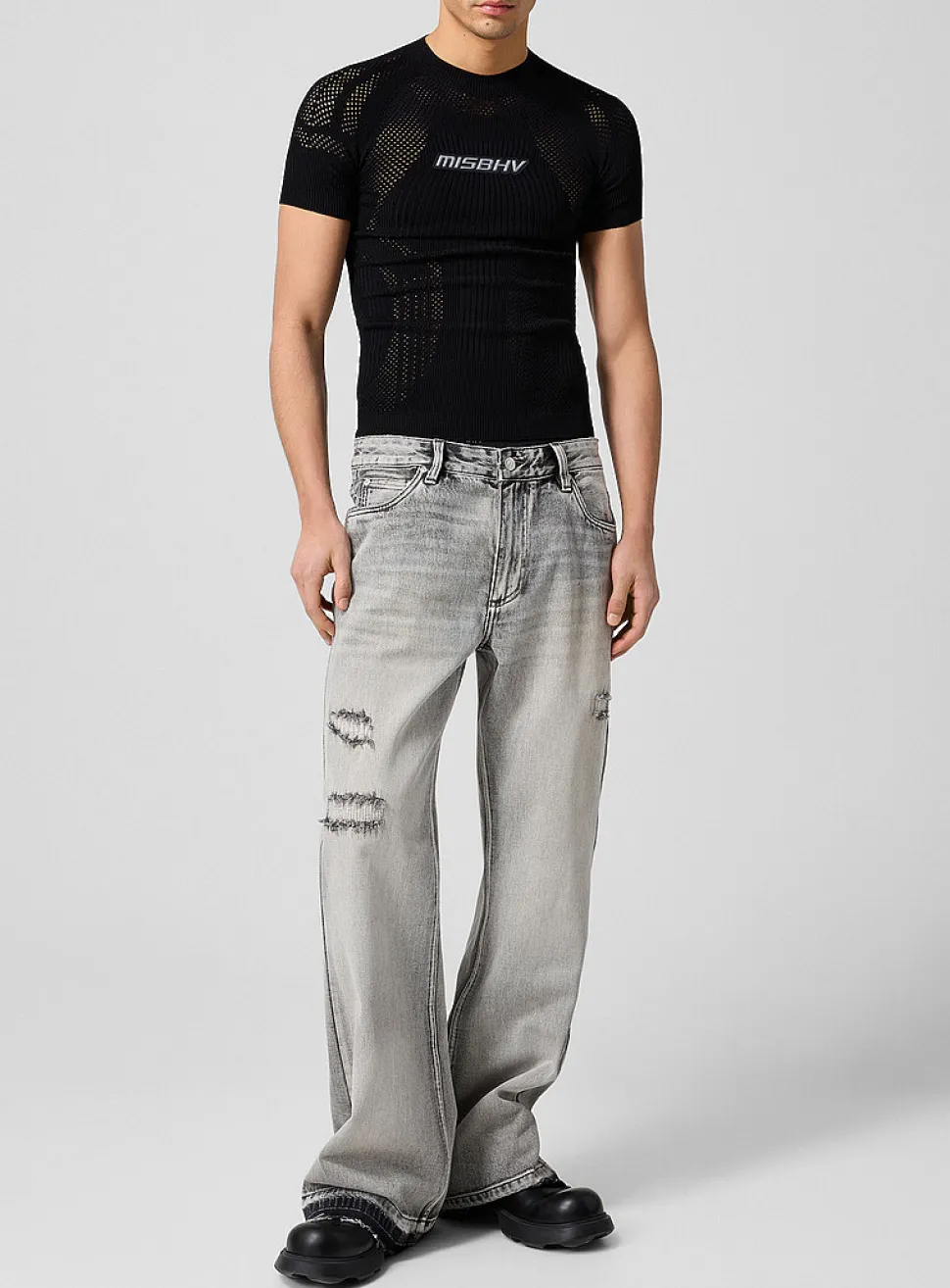Raw edging mended flared-leg jean