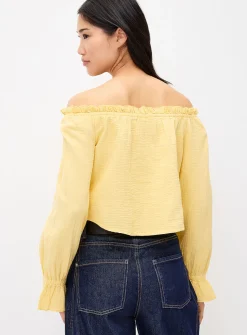 Ruffled off-the-shoulder blouse