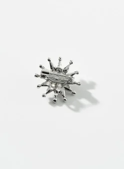 Small golden-star brooch