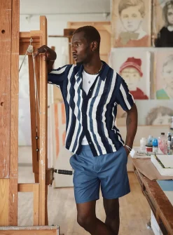 Striped pointelle-knit polo-collar cardigan